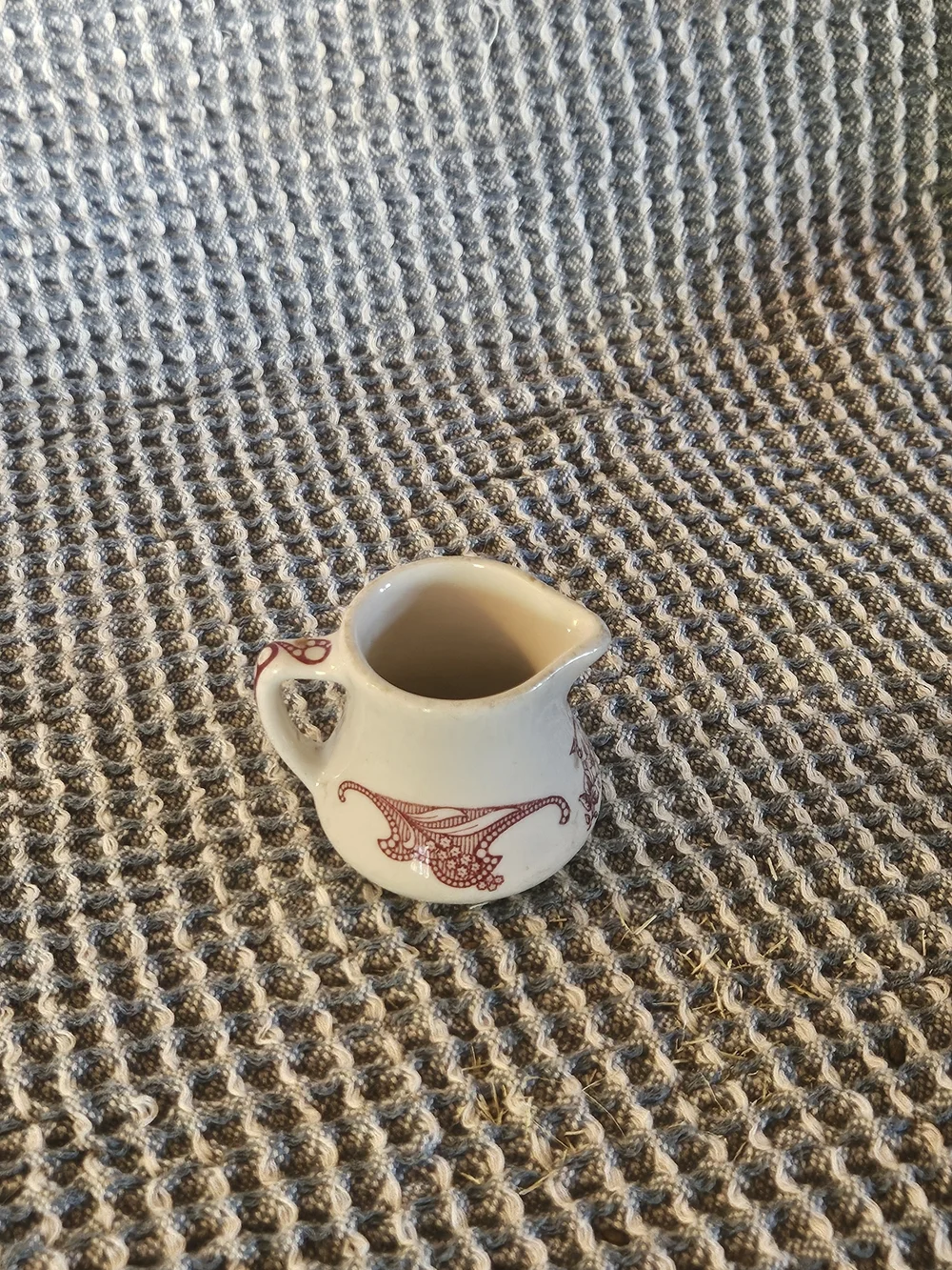 Cream Ceramic Mini Pitcher with Red Filigree Accent